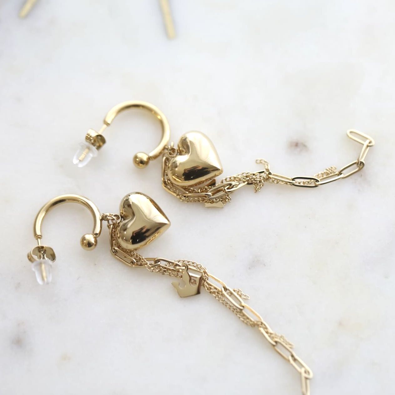 Close-up of Heart and Chain Design in Earrings by Mrs V